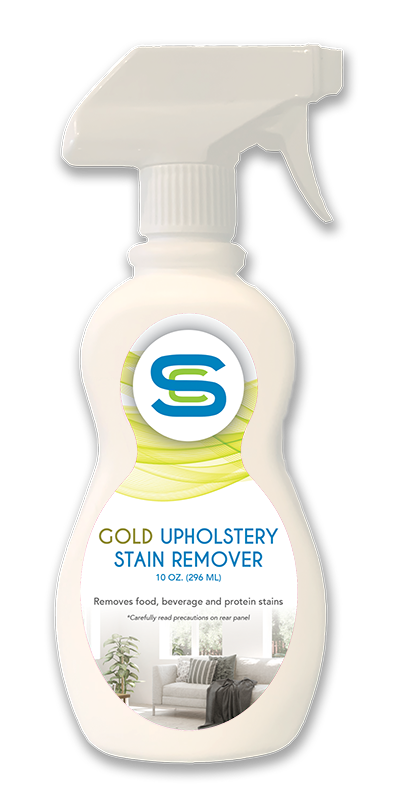 A bottle of gold upholstery stain remover on a white background.