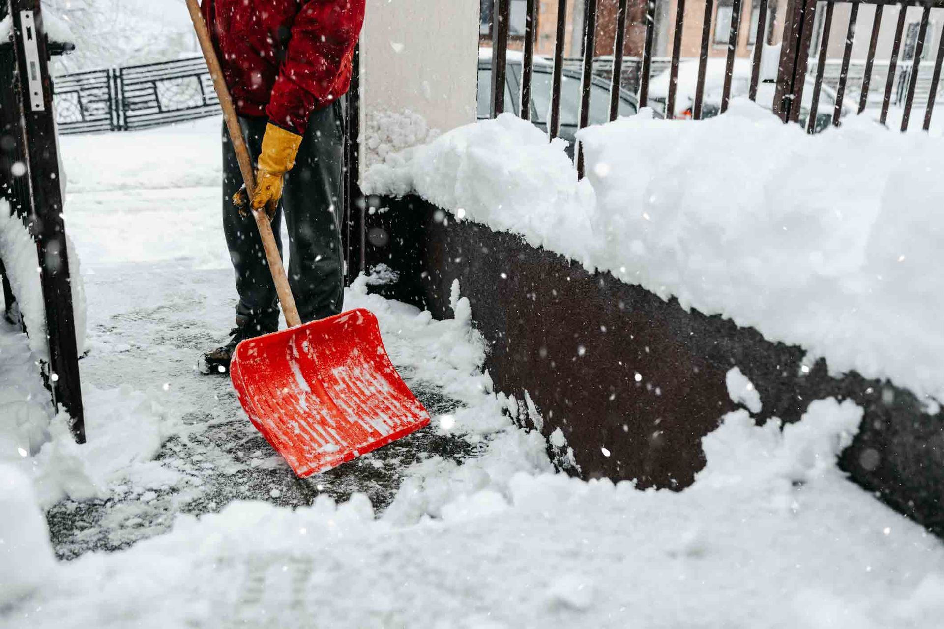 Man With Snow Shovel — Stewartville, MN — Complete Outdoor Service LLC