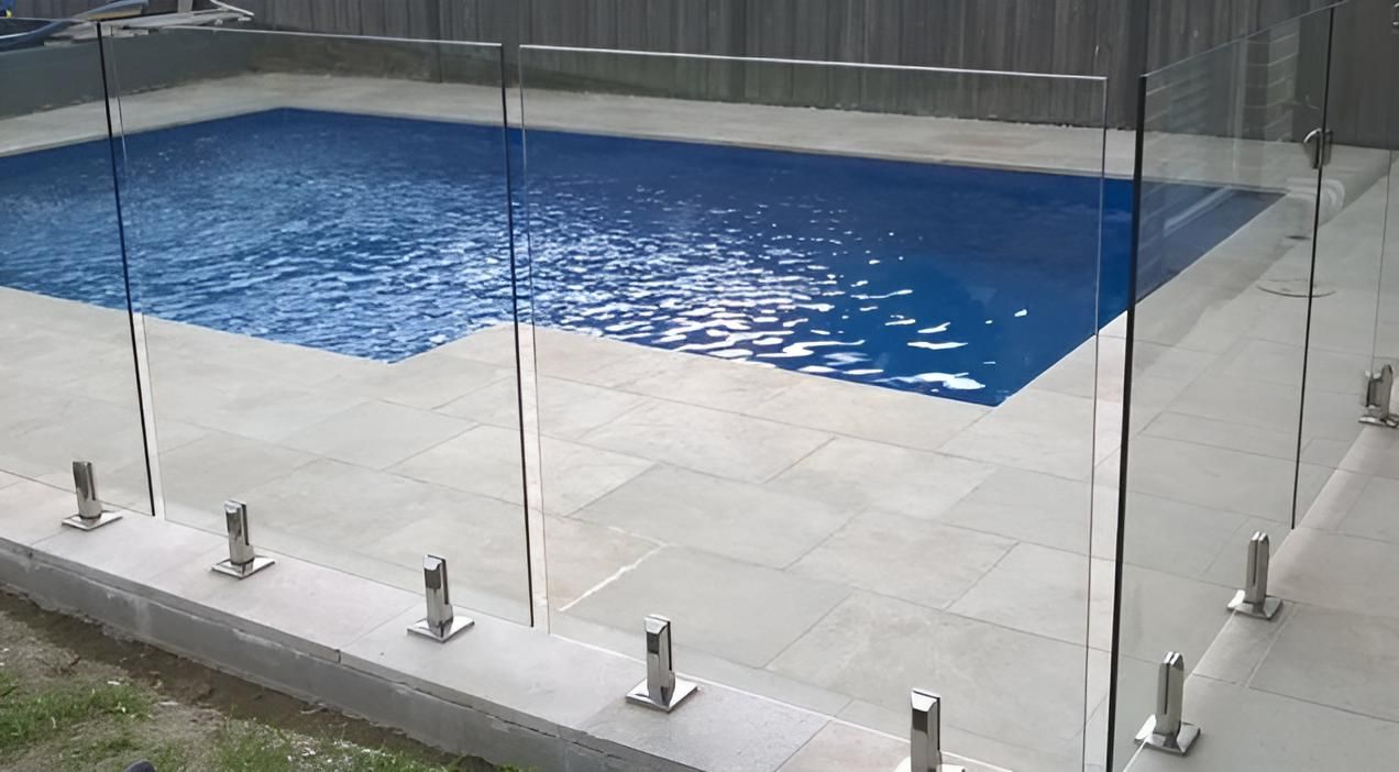 Three Horses Are Grazing In A Grassy Field Behind A Fence — A Betta Fence 'N' Yard In Port Macquarie, NSW