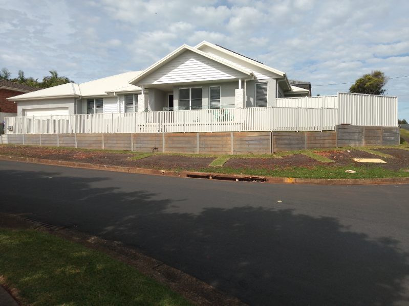 A Large White House With A White Fence Around It — A Betta Fence 'N' Yard In Thrumster, NSW