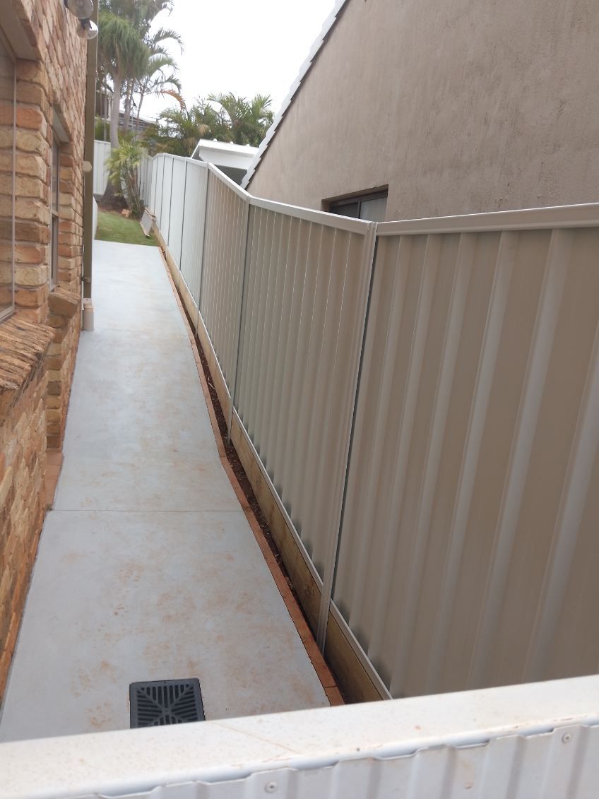 A Walkway With A Fence Along The Side Of It — A Betta Fence 'N' Yard In Port Macquarie, NSW