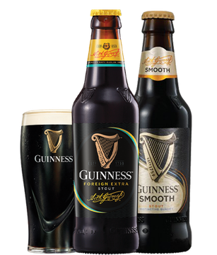 Two bottles of guinness and a glass of guinness