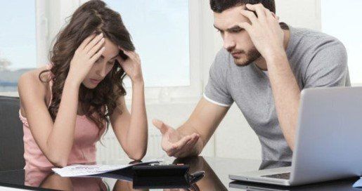 couple stressed from debt - Drake Ozment Bankruptcy attorney with offices in West Palm Beach and Port St. Lucie, Florida