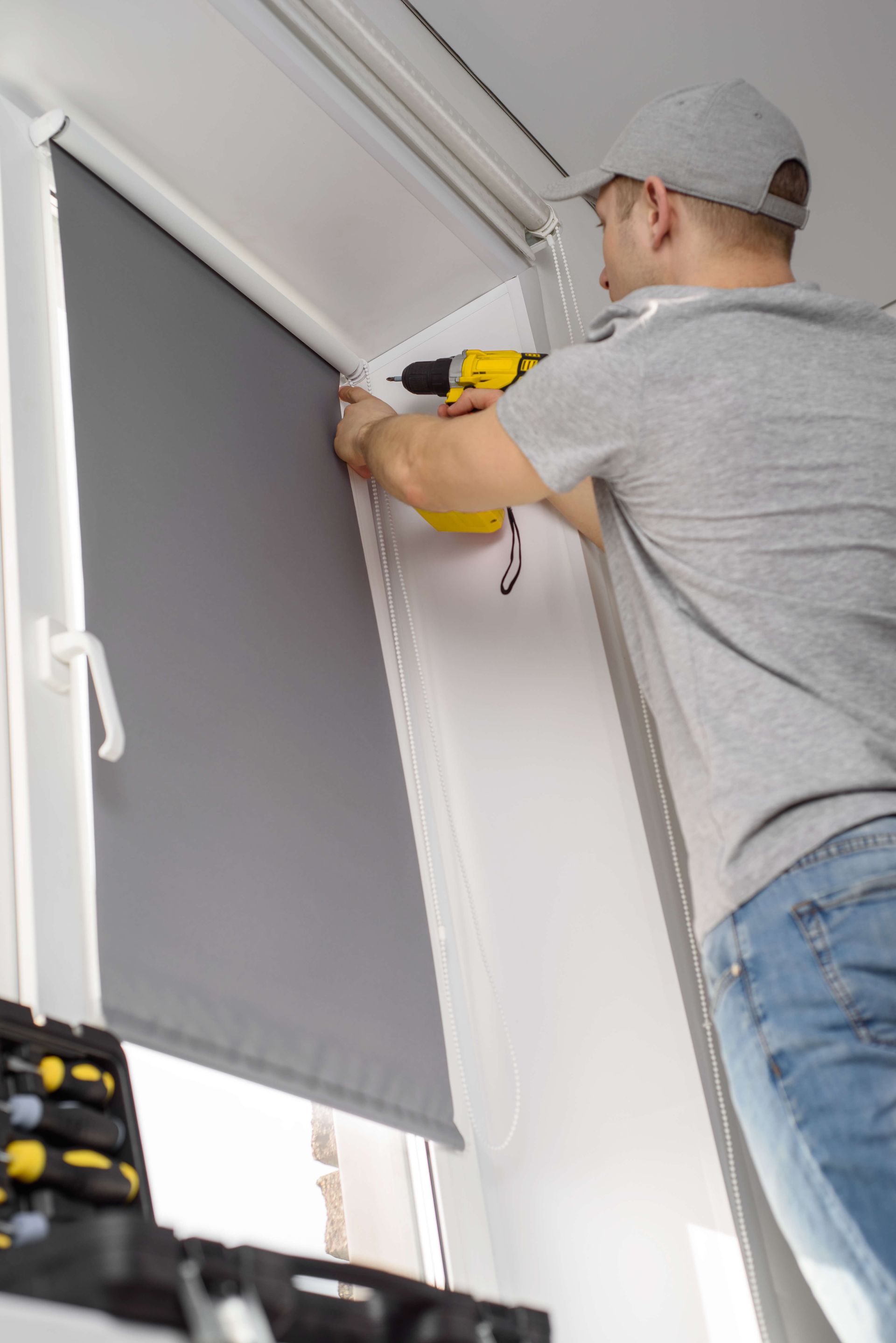Man Installing Roller Blinds