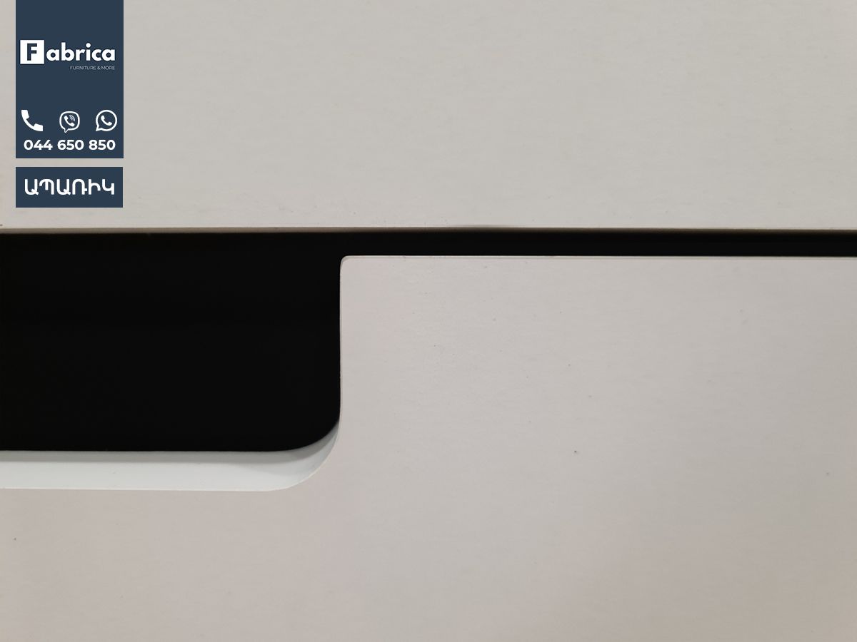 A close up of a white printer with a blue label on it.