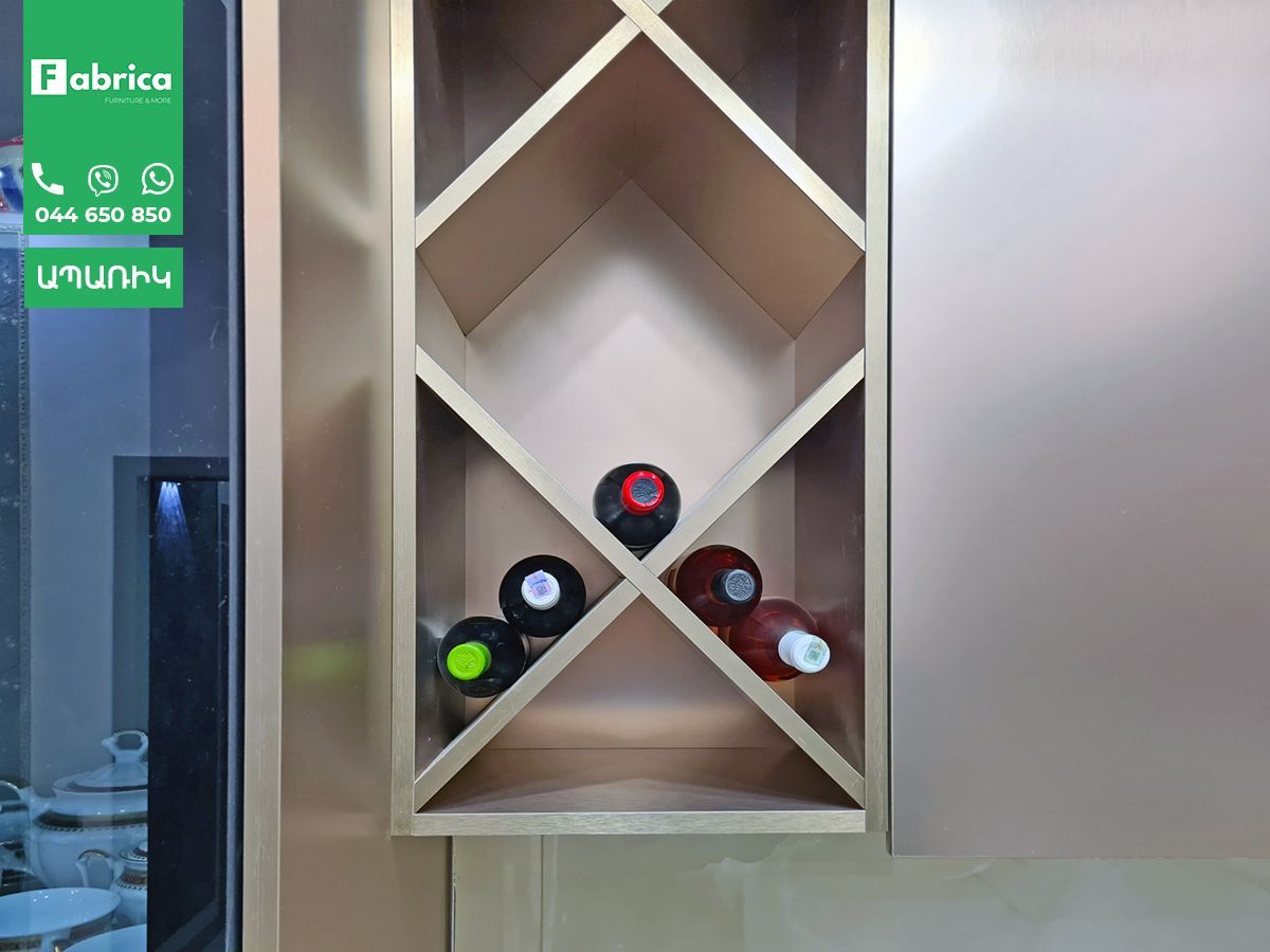 A wooden wine rack with bottles of wine in it