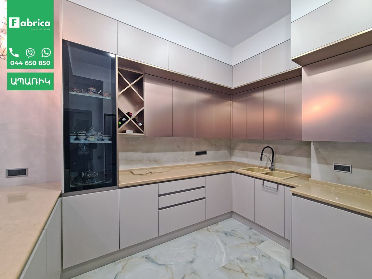 A kitchen with stainless steel cabinets and granite counter tops.