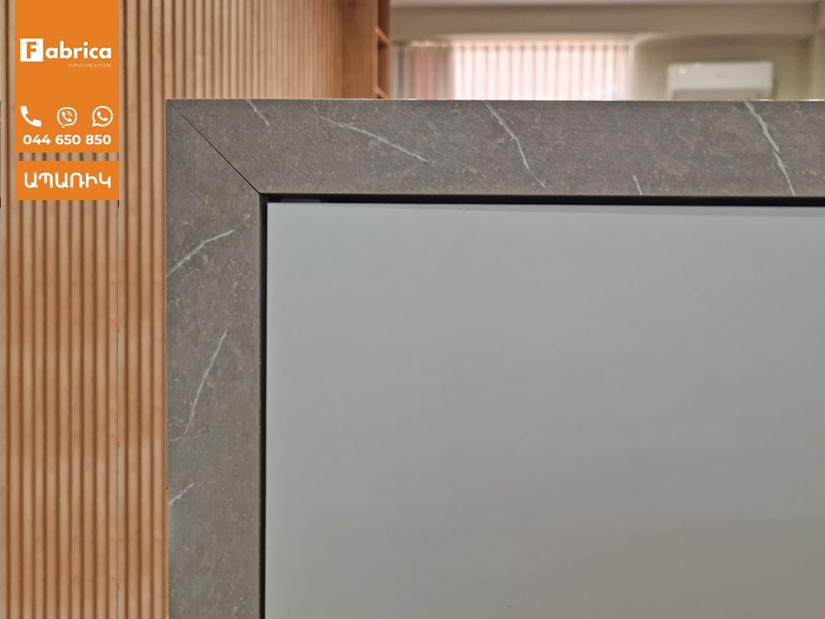 A close up of a piece of furniture with a wooden wall in the background.