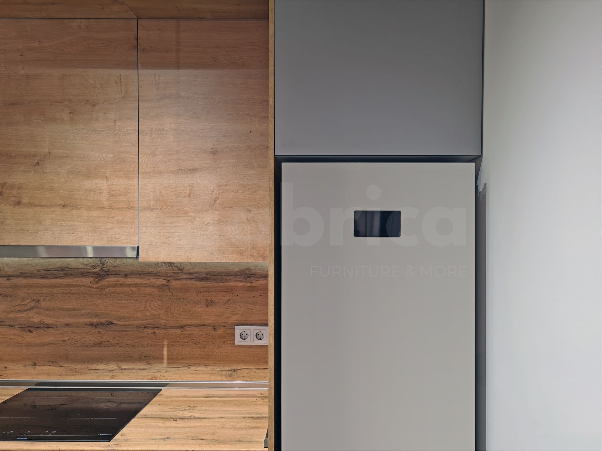 A kitchen with wooden cabinets and a white refrigerator.