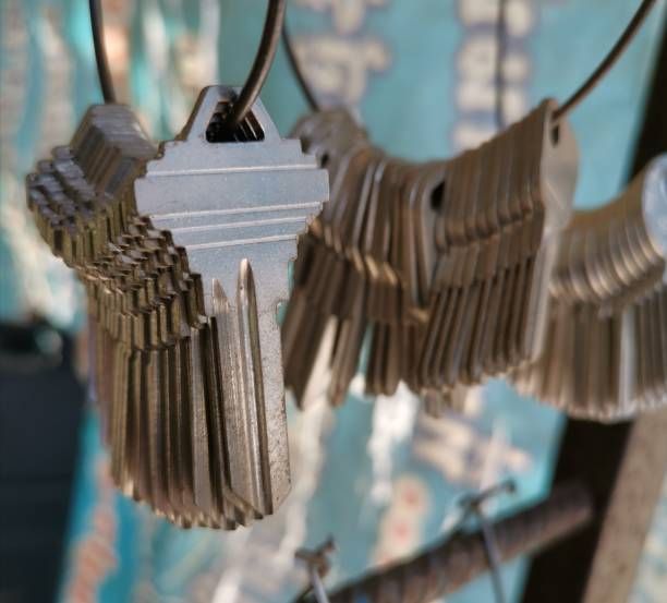 A bunch of keys hanging from a metal ring
