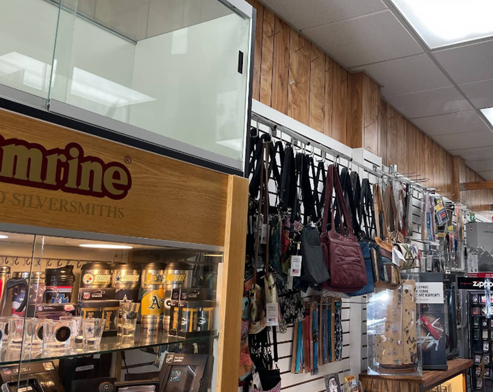 A store front with a sign that says mel 's shoe repair