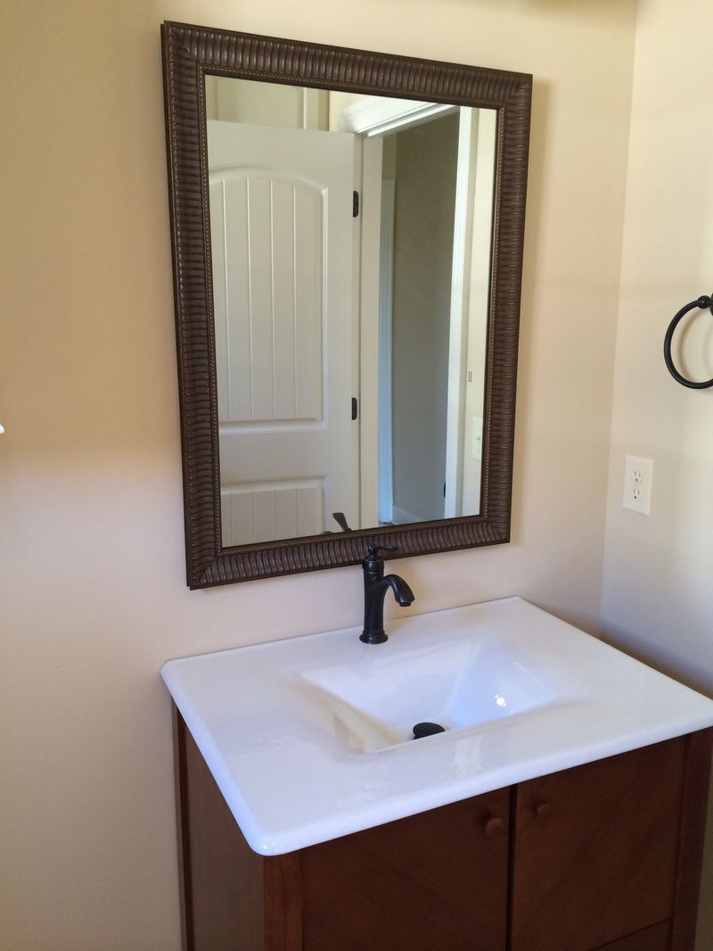 Broken Glass Repair — Mirror in Front of Sink in Jackson,MS