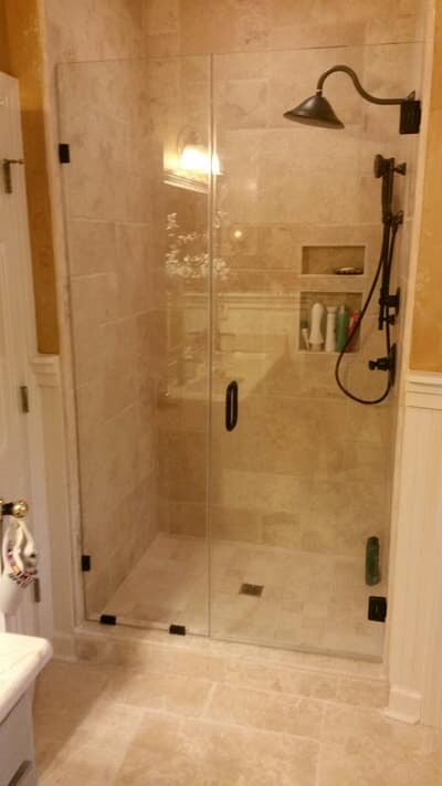 Glass — Shower Door With Brown Tiles in Jackson,MS