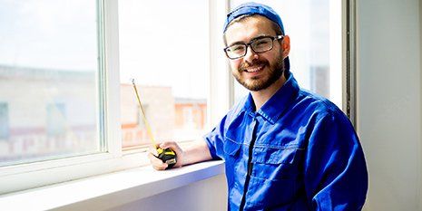 Broken Glass Repair  — Worker Installing Glass Window in Jackson, MS