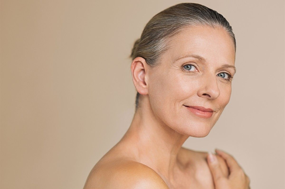 Mature woman with clear skin, representing Skin Classic high frequency treatment for skin imperfections in Albuquerque.