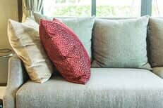Red & Beige Pillows on sofa - Upholstery in Monterey, CA