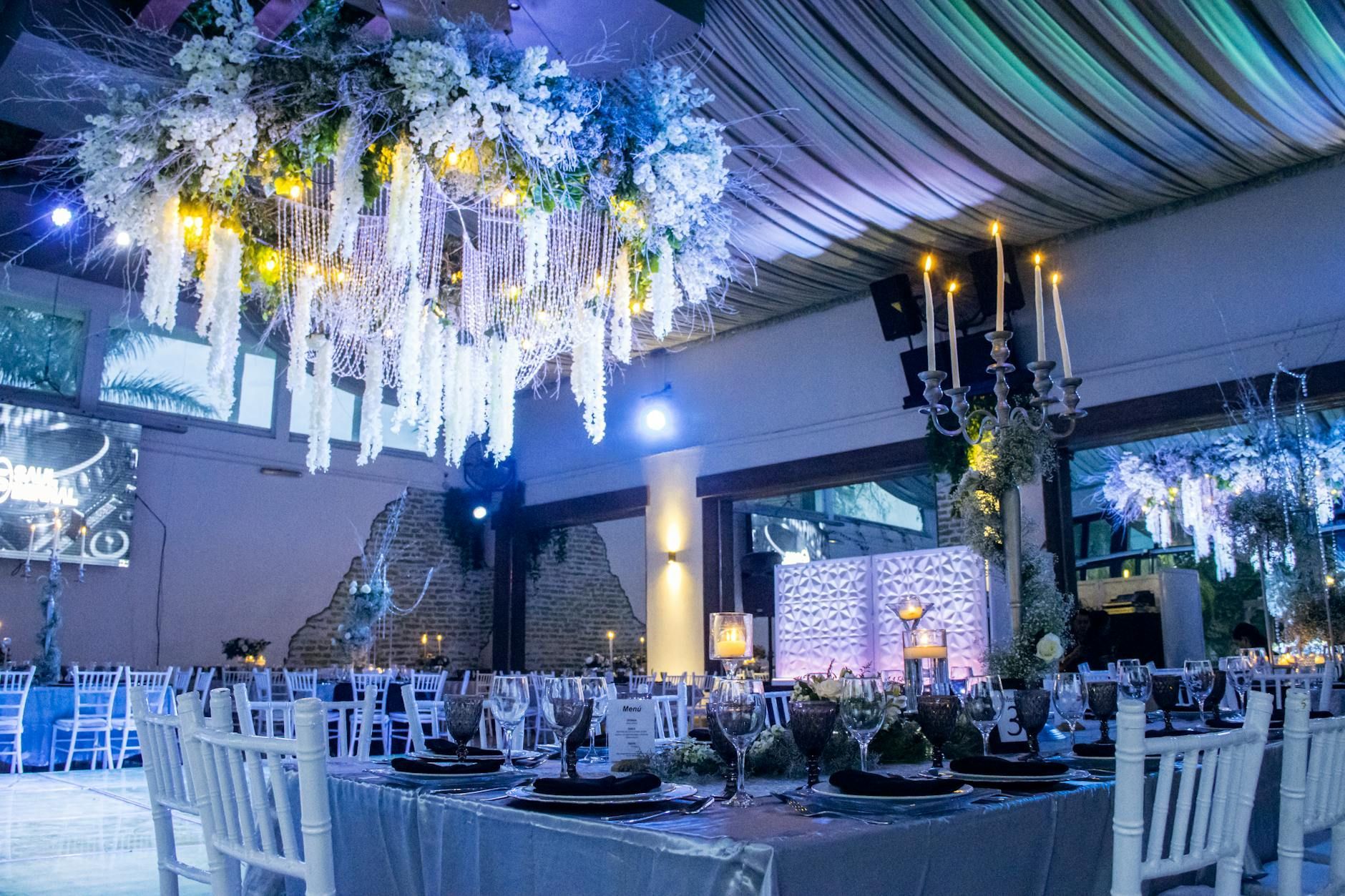 A sophisticated party events venue illuminating with blue lights celebrating a fun party.
