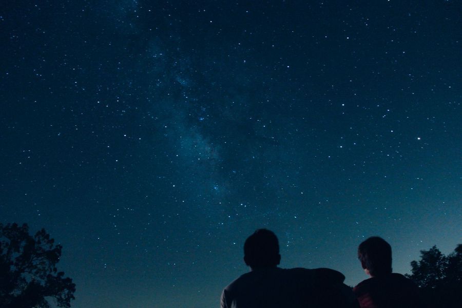 Two young men stargazing