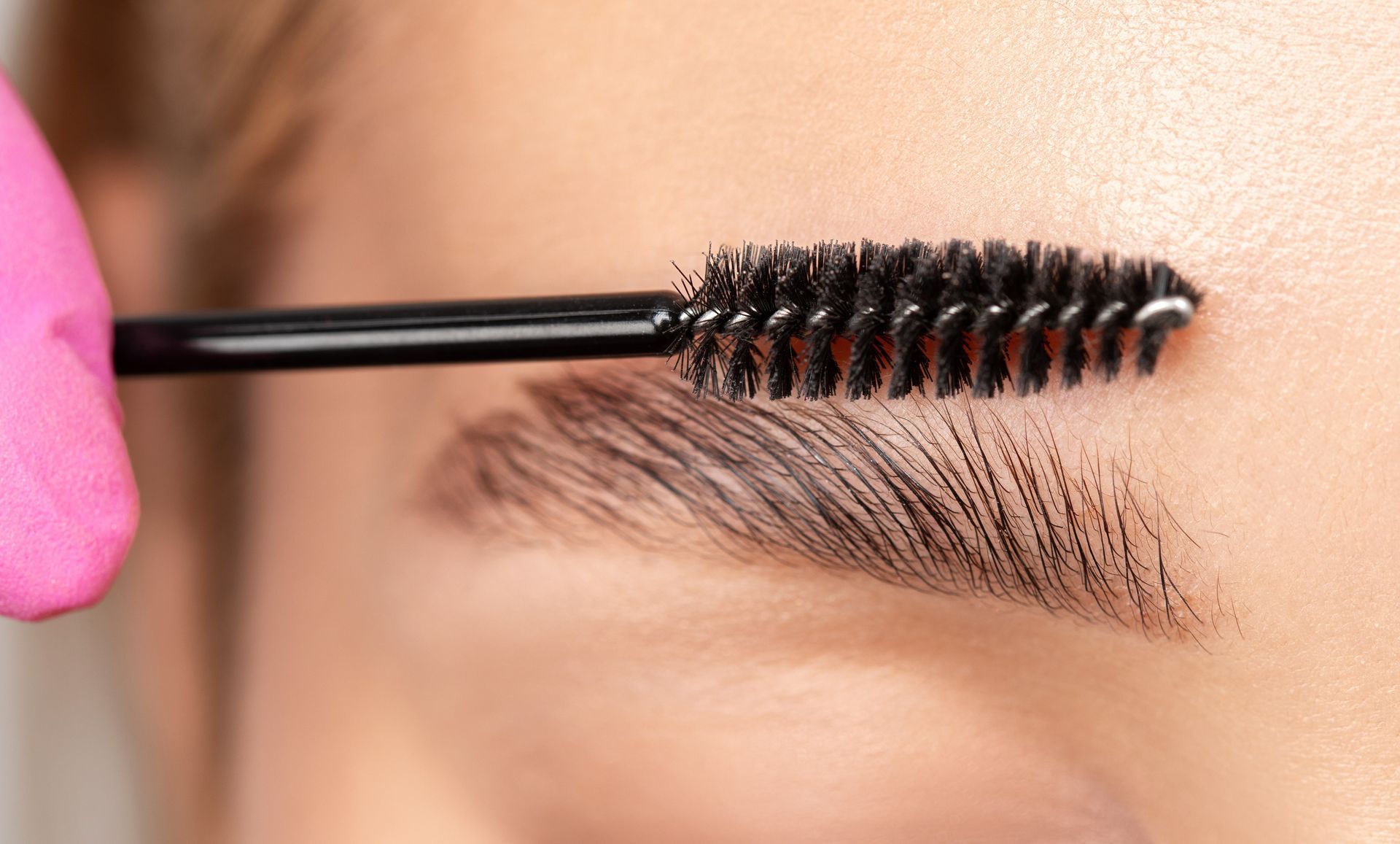 Eyebrow being brushed