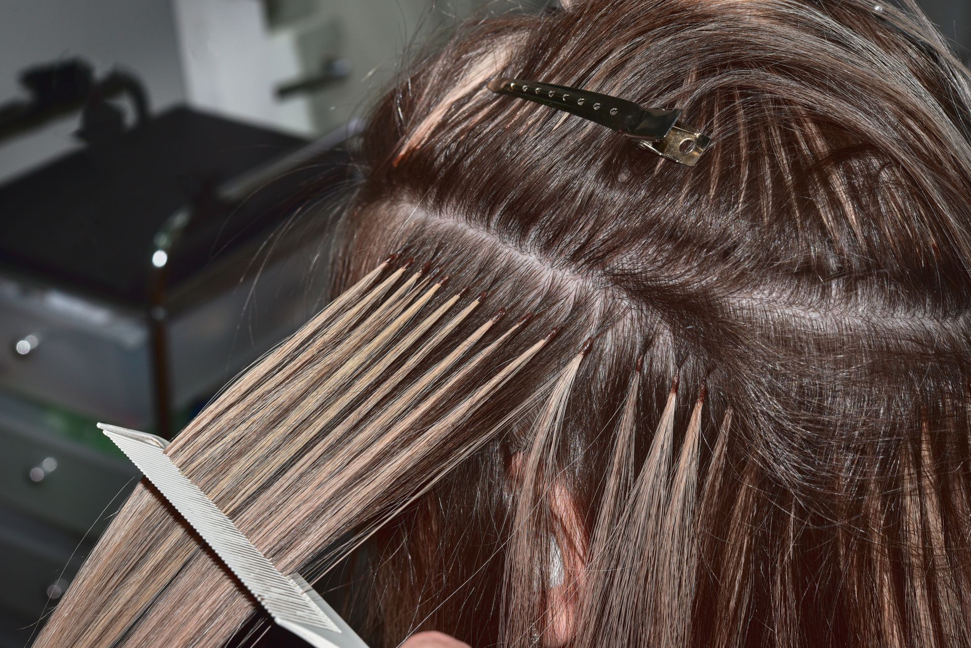 Person getting hair extensions