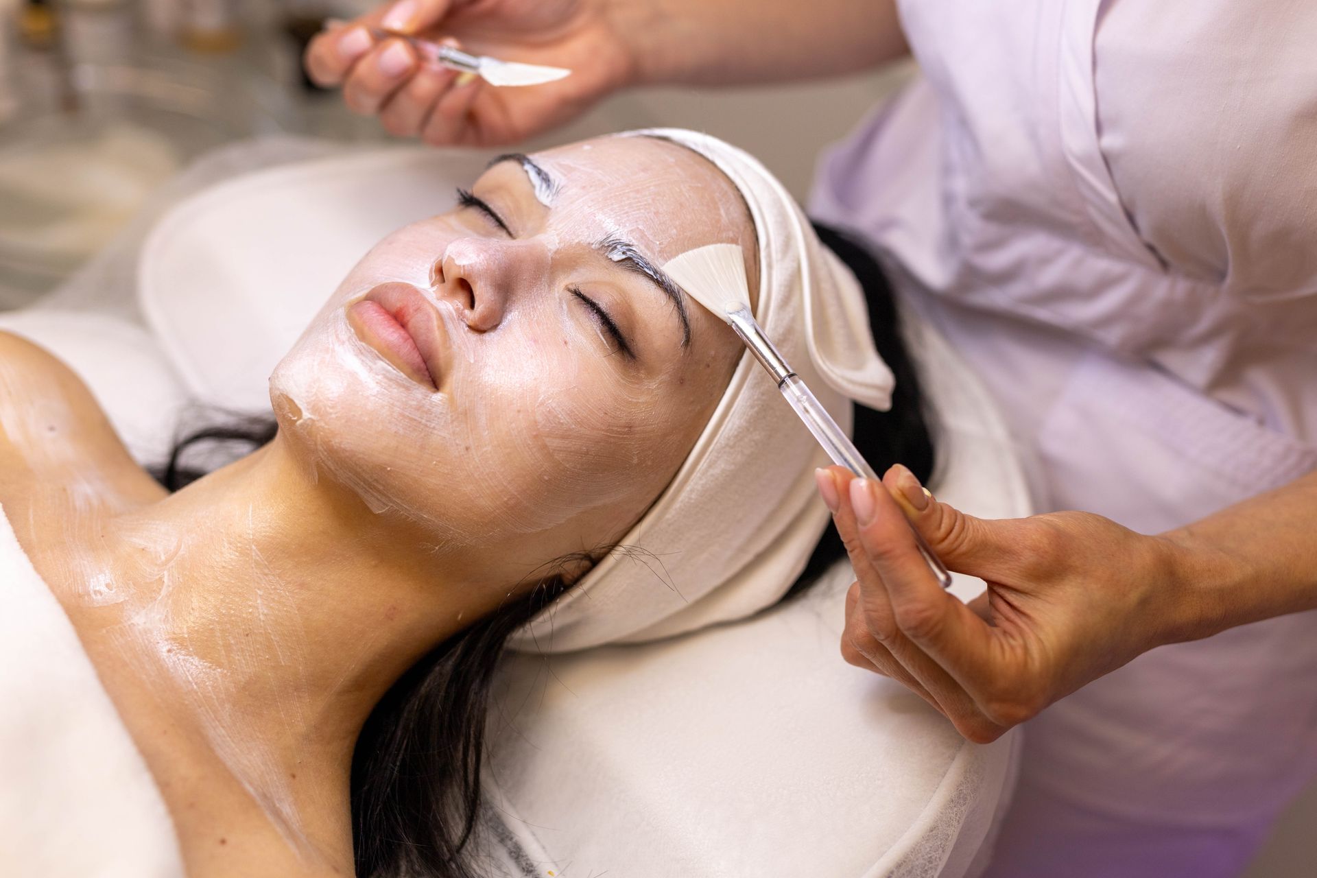 Person receiving facial treatment