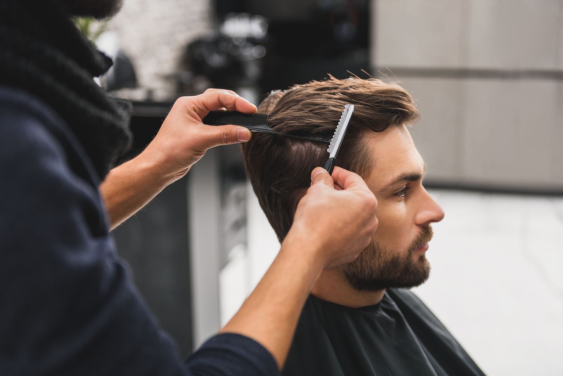 Barber cutting a man's hair