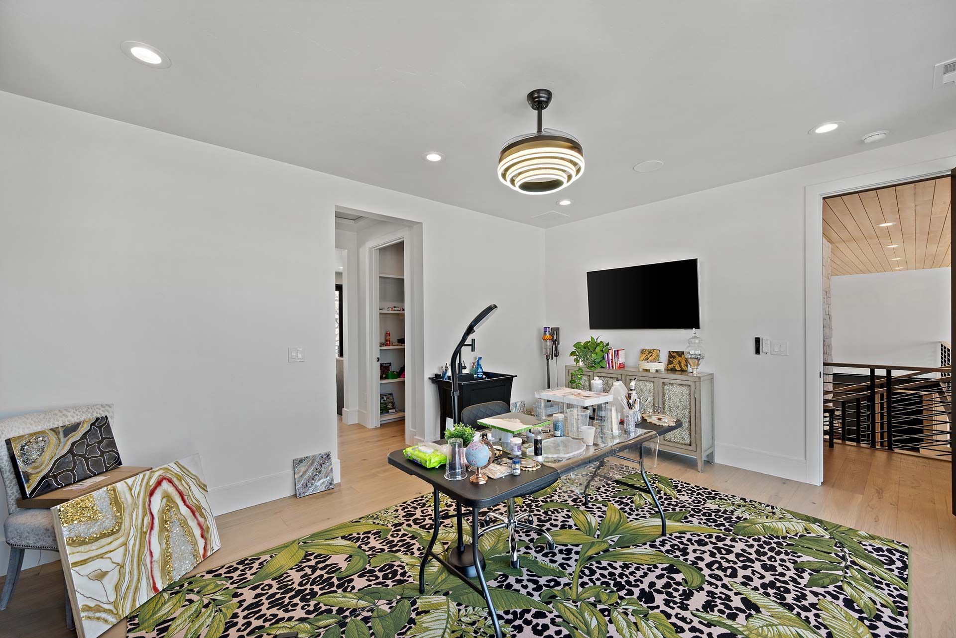 Living Room with Tables, Chairs, Rugs and Television