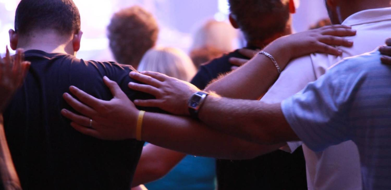 A group of people are running on a road.