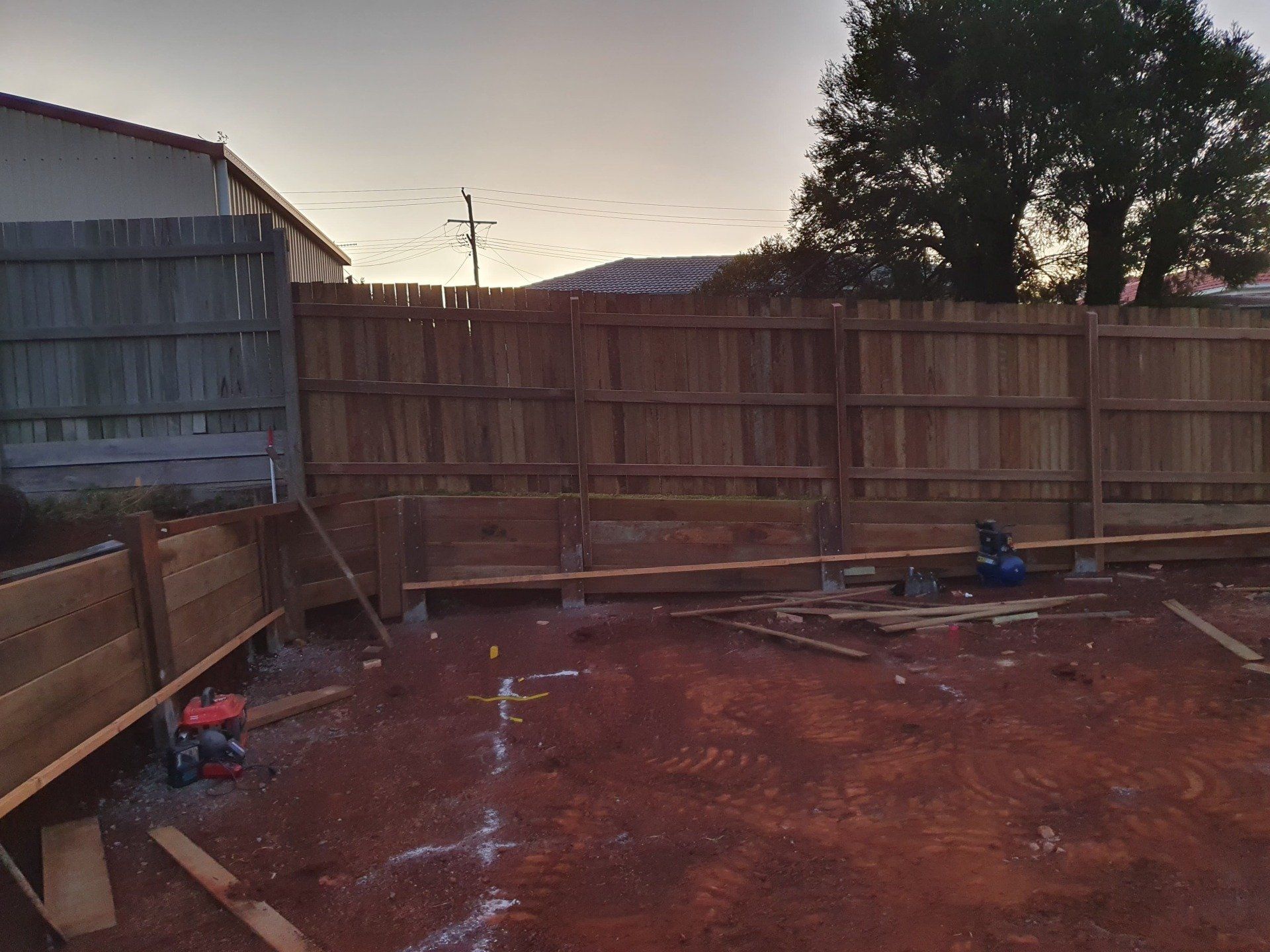 Timber retaining wall and with timber fence