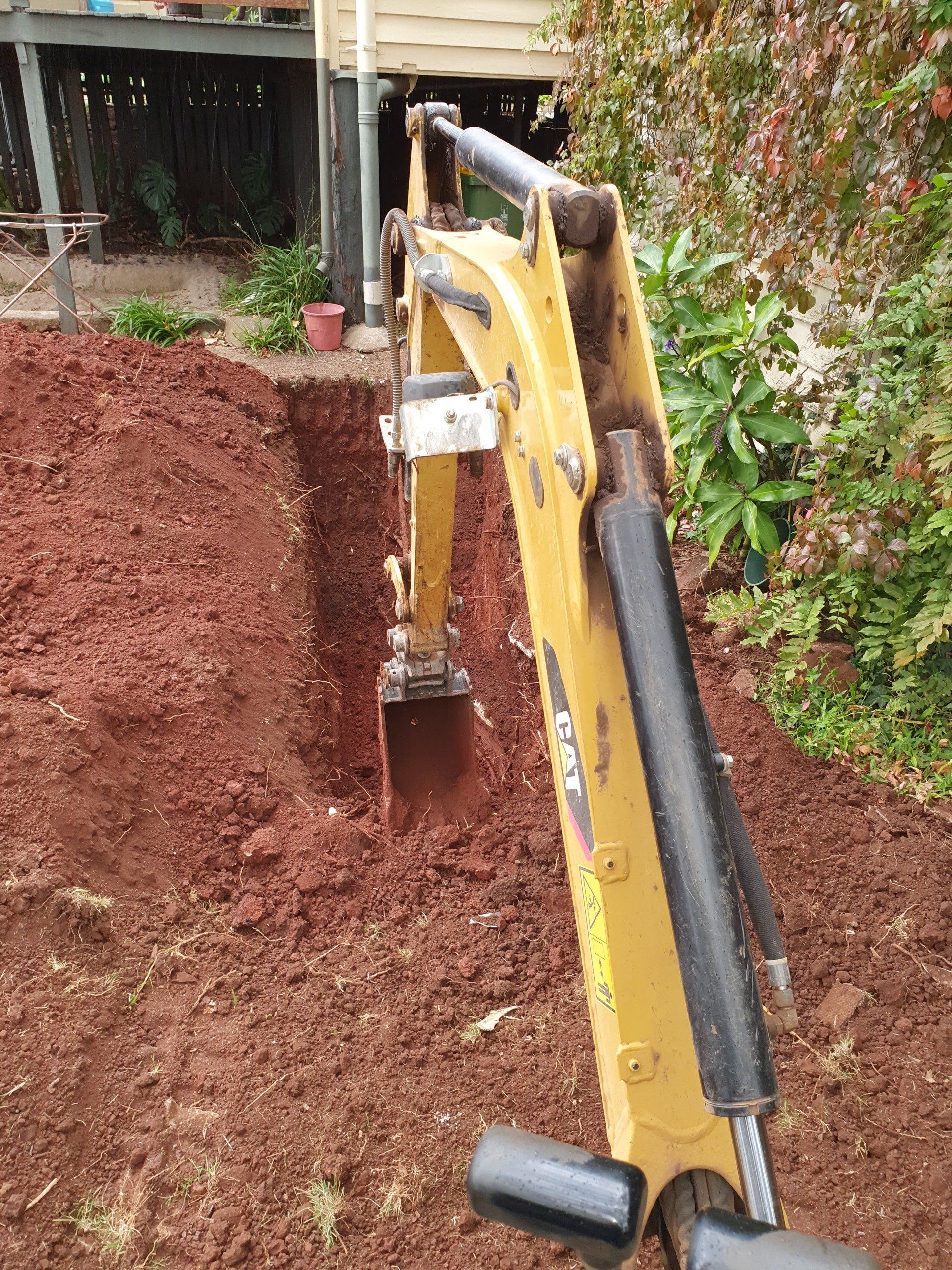 Digging a trench in a residential backyard