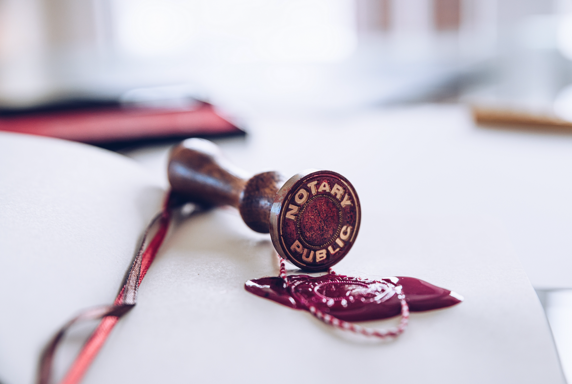 A notary public stamp is sitting on top of a piece of paper.