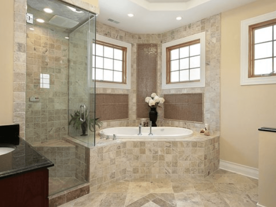 A bathroom with a bathtub and a walk in shower.