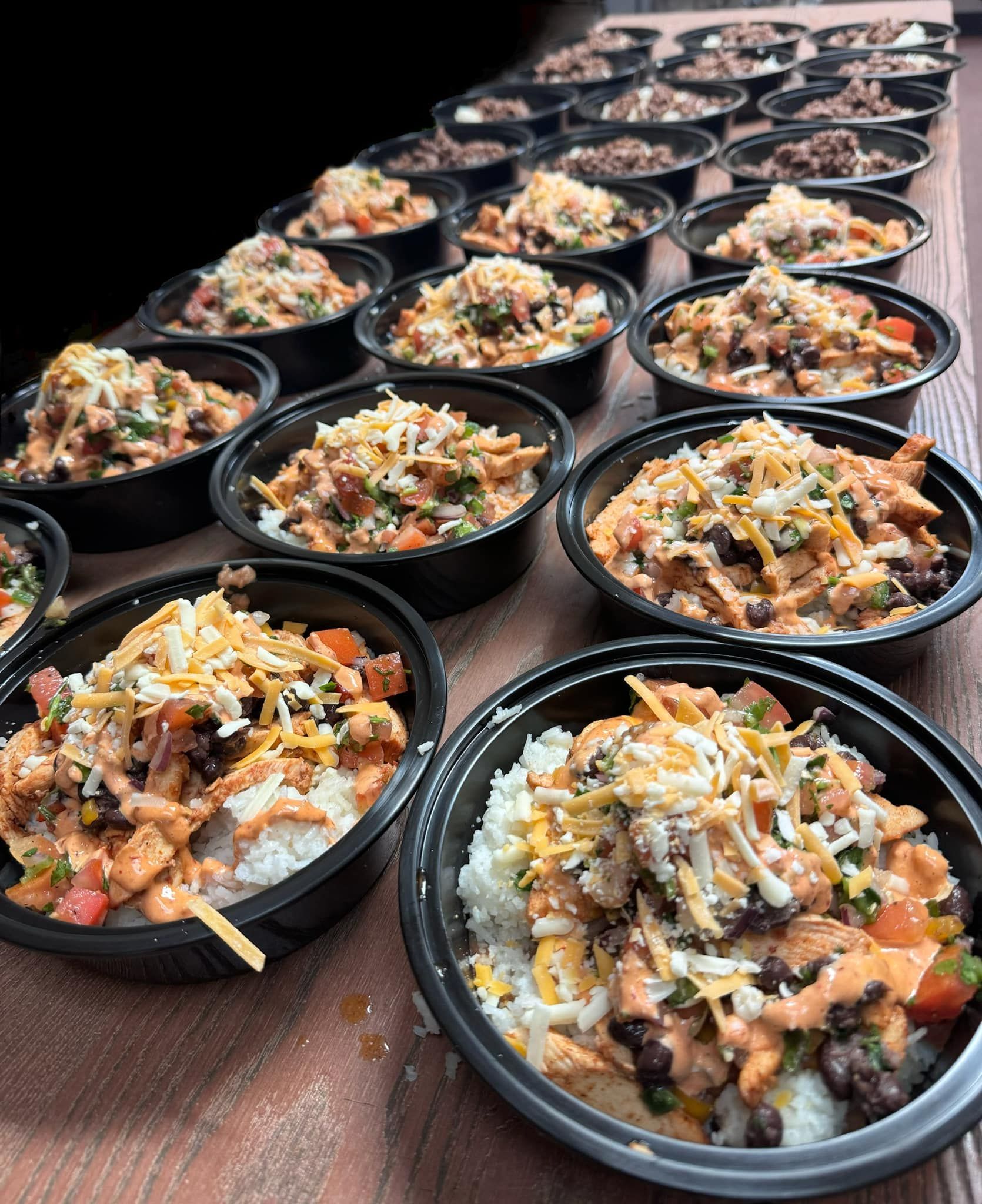 A bunch of bowls of food are sitting on a table.