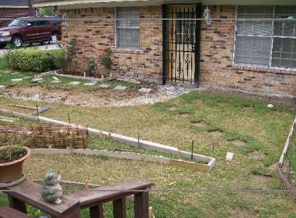 A brick house with a lawn in front of it