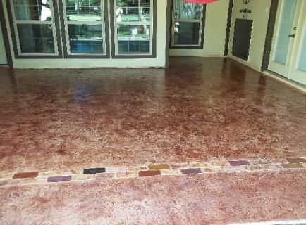 A room with a brick floor and a brick border