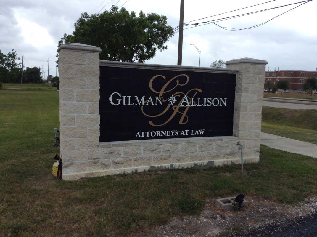 A sign that says gilman & allison on it