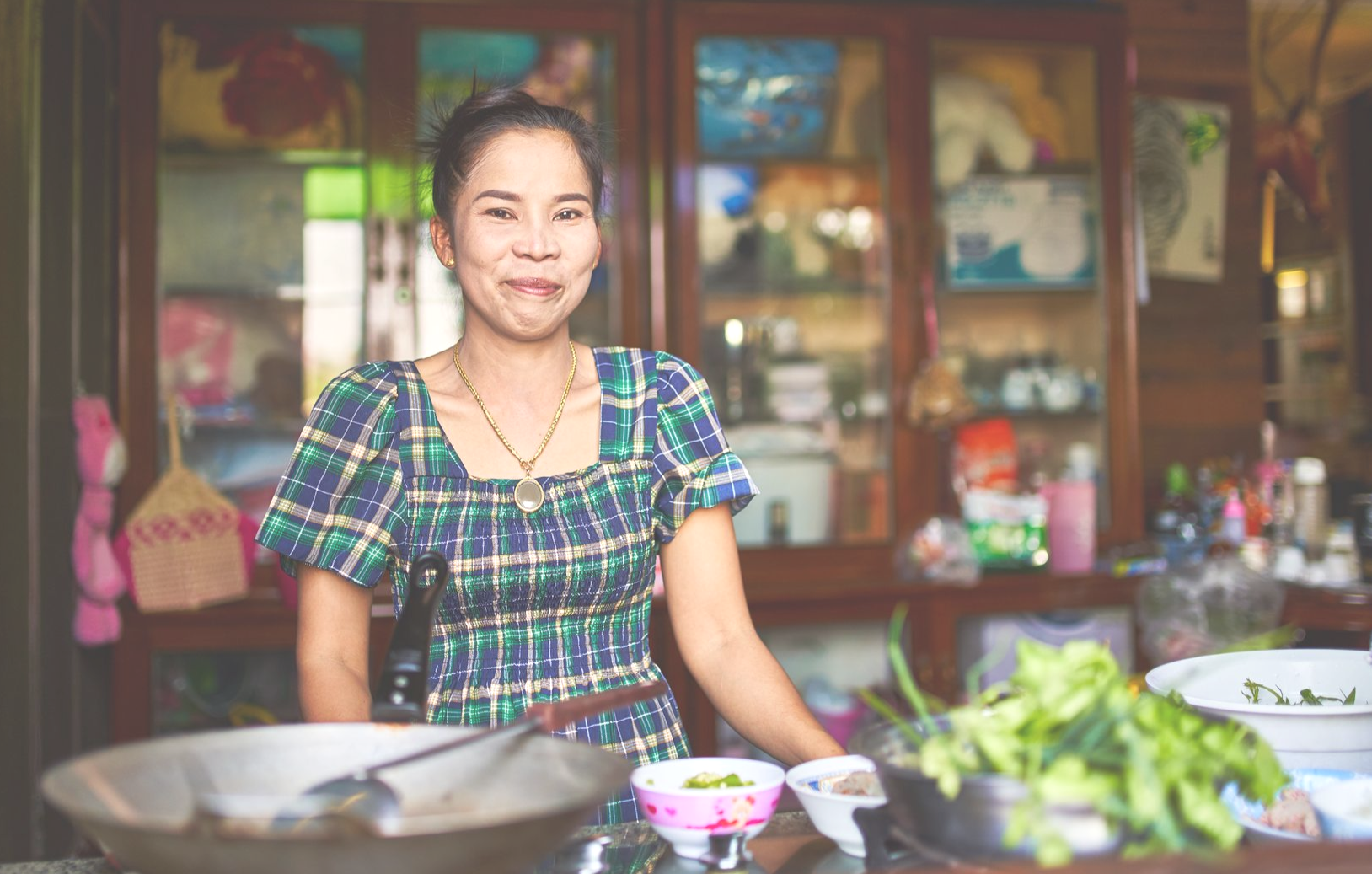 Proud Thai student with her new food shop open