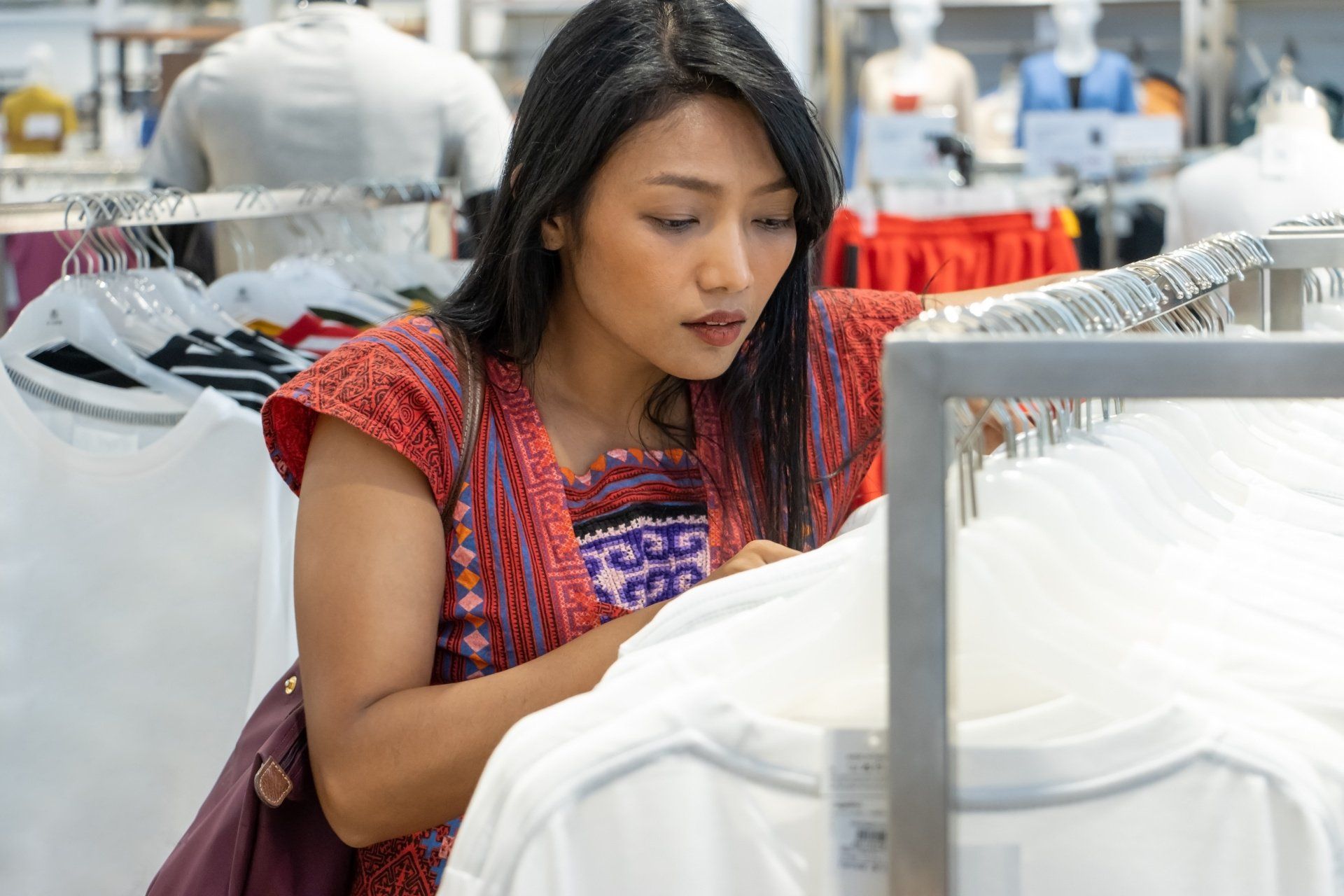 Thai woman shopping for shirts