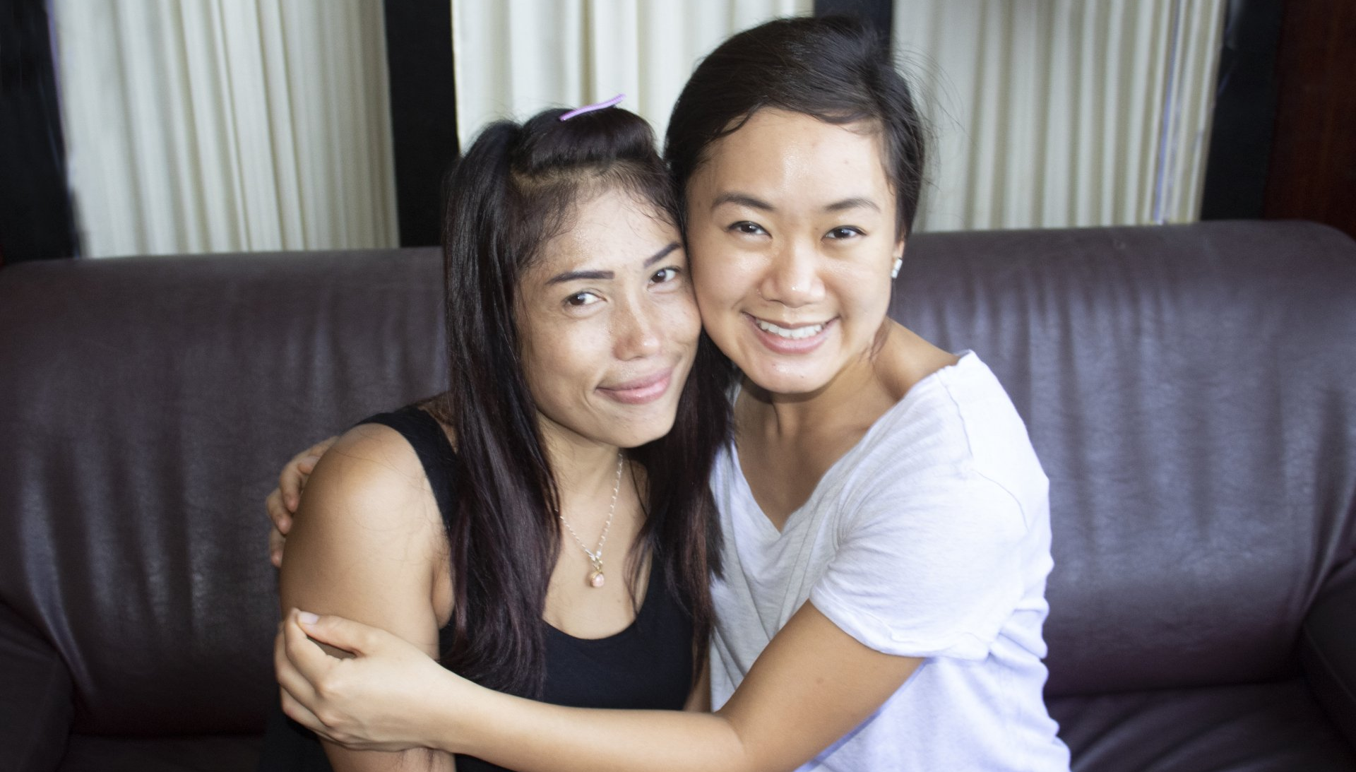 Volunteer and student hug in Pattaya, Thailand