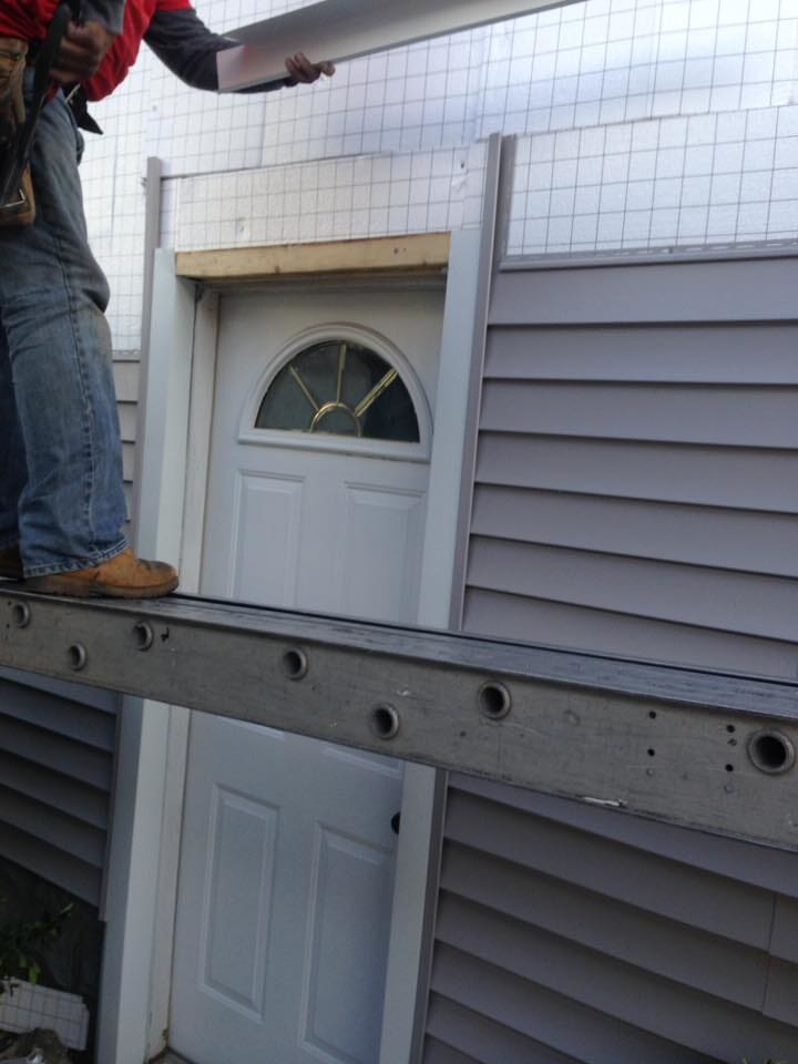 Vinyl Siding by door — Home Improvement in Floral Park, NY