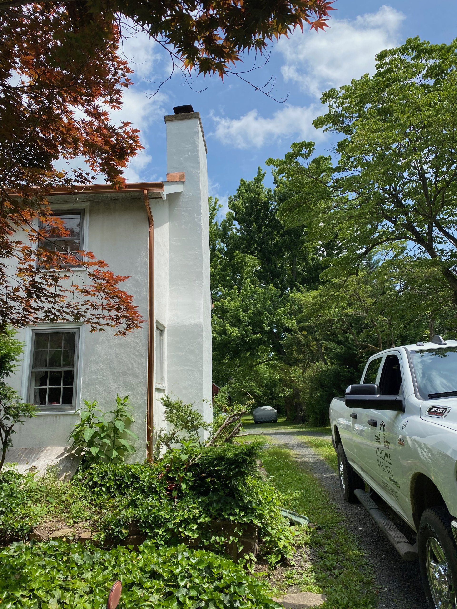 1700s Farmhouse Exterior Stucco Chimney Restoration — Warminster, PA — Disciple Masonry