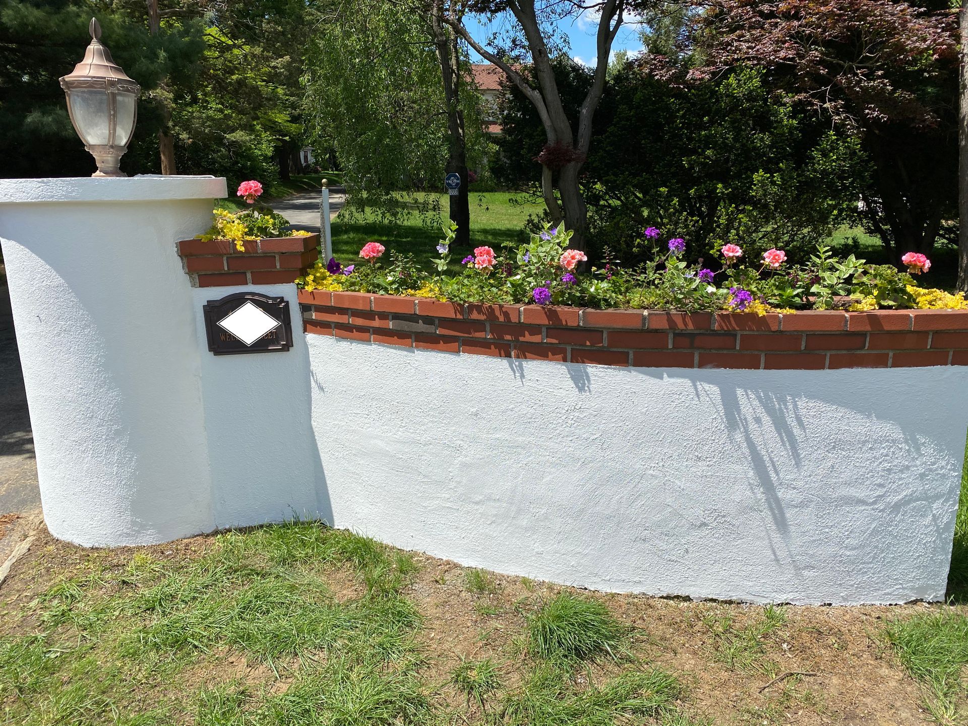 Stucco and Brick Flower Garden Bed Wall - Lafayette Hill, PA - Disciple Masonry