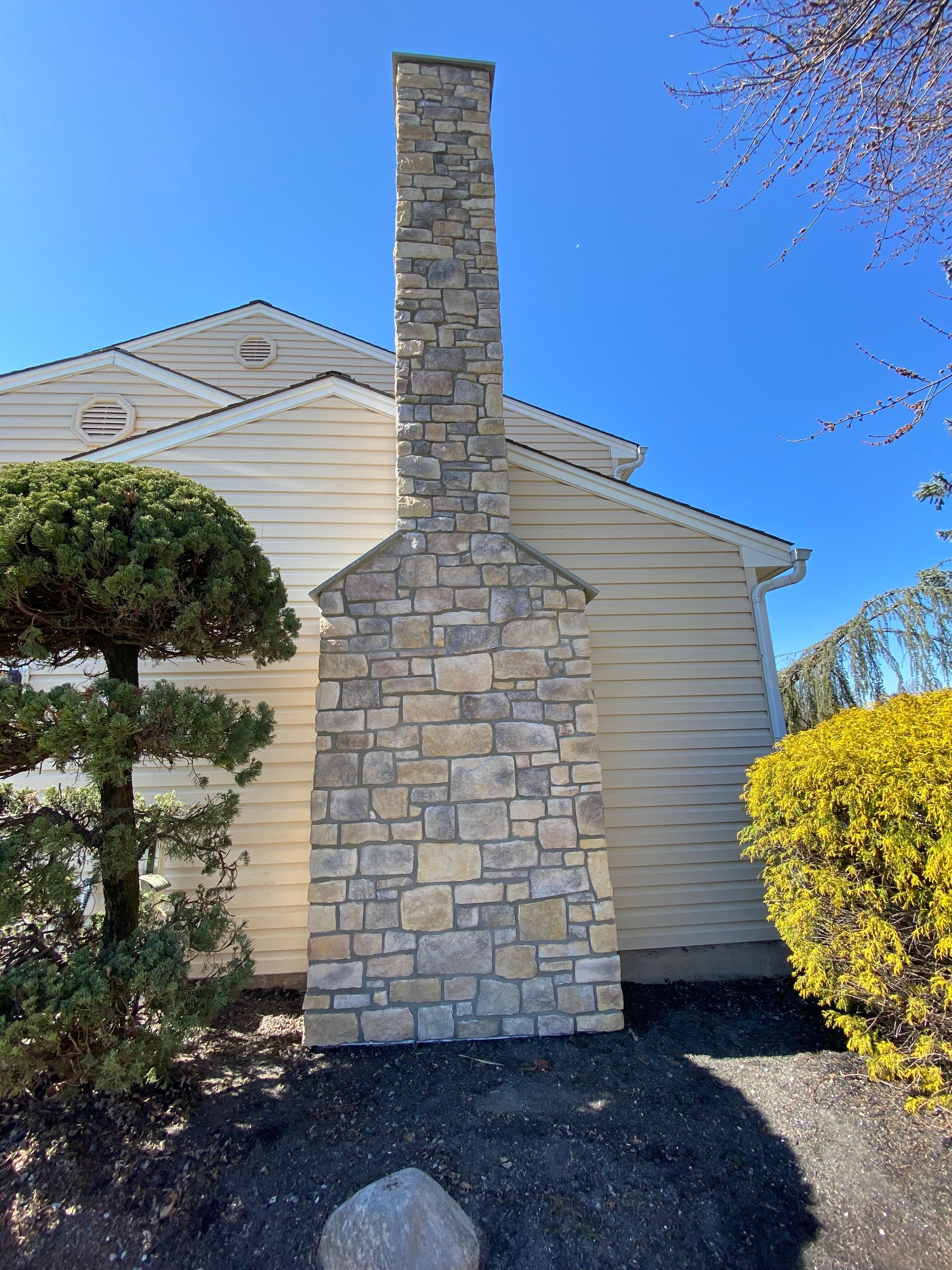 Stone Veneer on Exterior Chimney - South Hampton, PA - Disciple Masonry