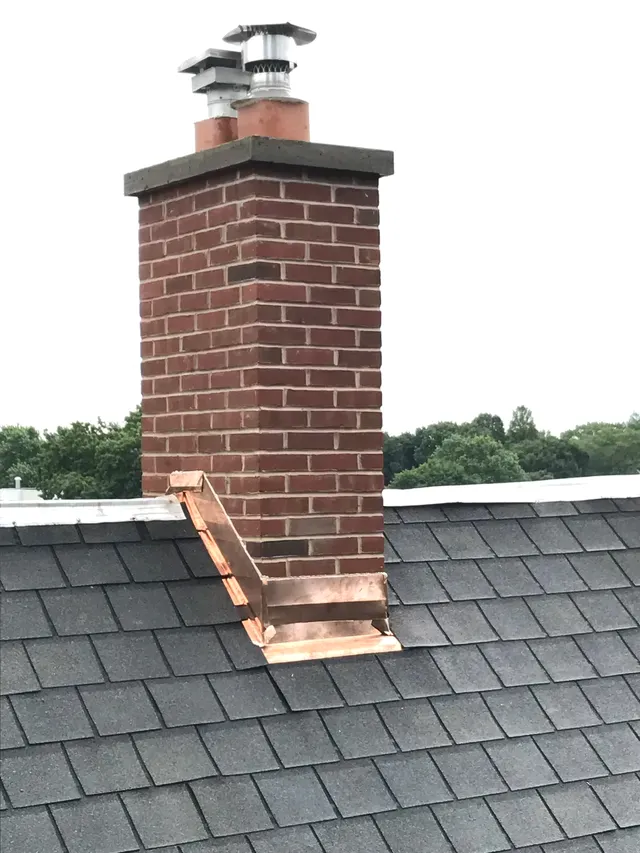 Brick Chimney with Bluestone Capping and Copper Flashing — Radnor, PA — Disciple Masonry