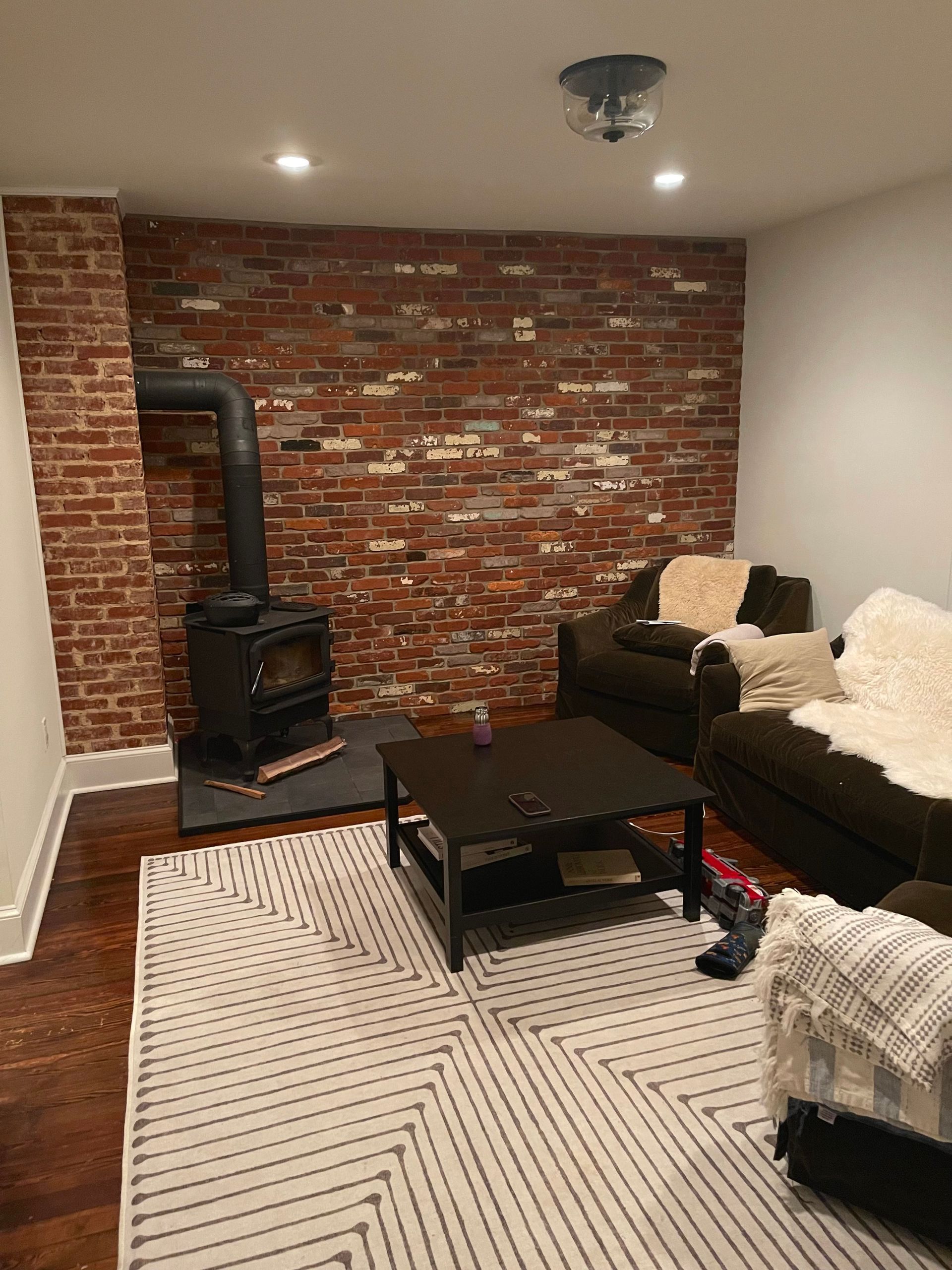 Brick Wall Installation in Living Room Inside Home  - Fort Washington, PA - Disciple Masonry