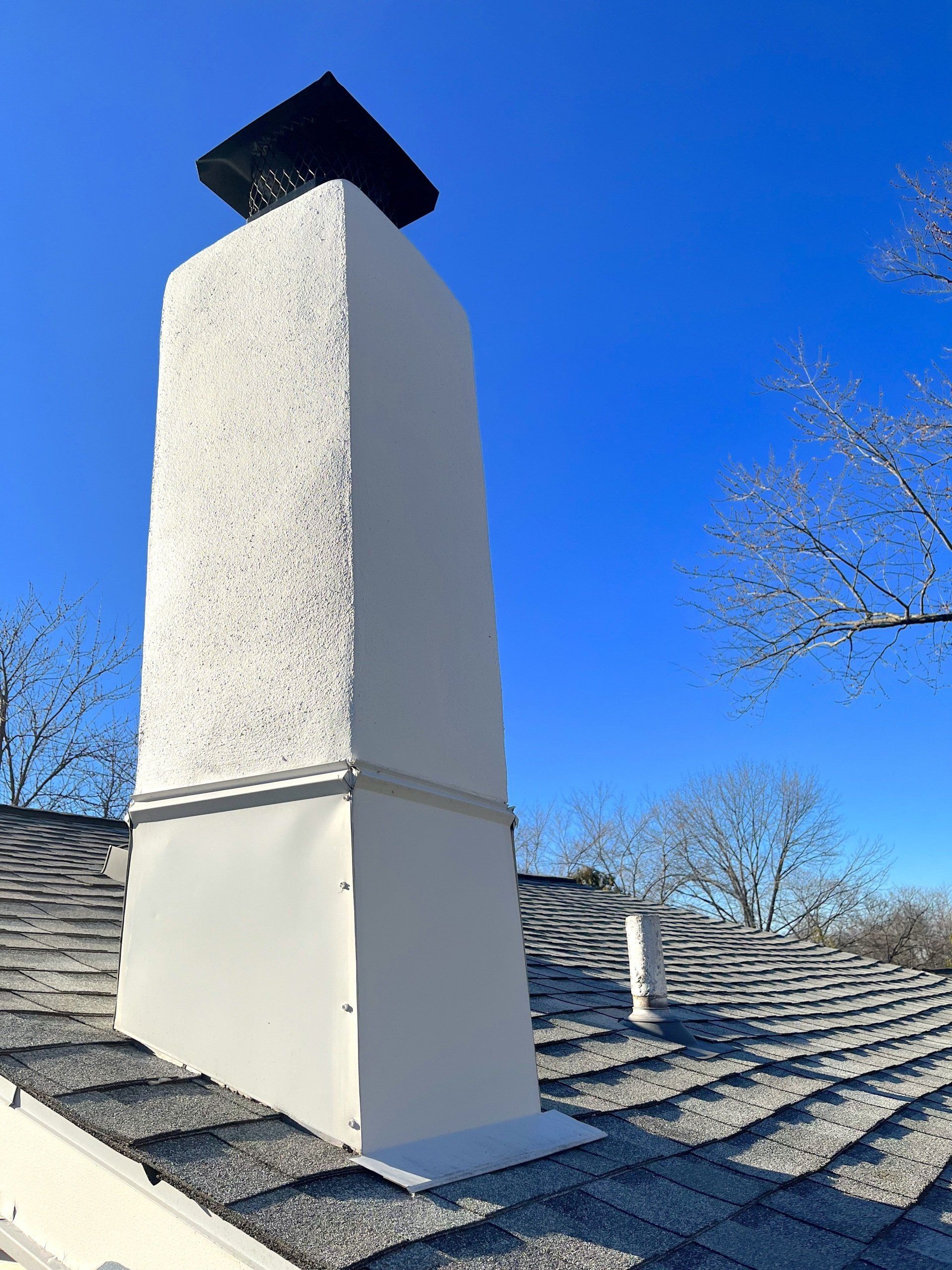 Smooth White Stucco Chimney Repair with Chimney Cap - Lansdale, PA - Disciple Masonry