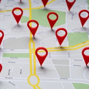 Red map pins marking multiple locations on a street map with highlighted yellow routes.