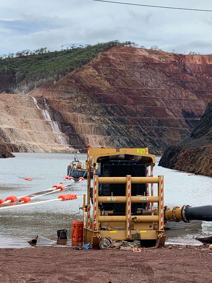 Mining Machinery Going Into Lake — Business Support Services Near Bowen, QLD