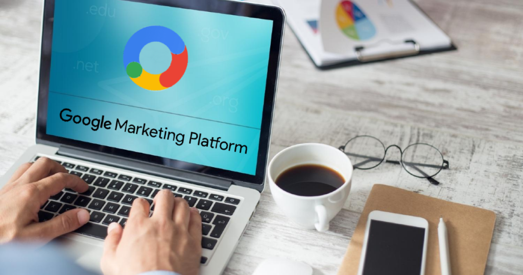A person is typing on a laptop with a google marketing platform on the screen.