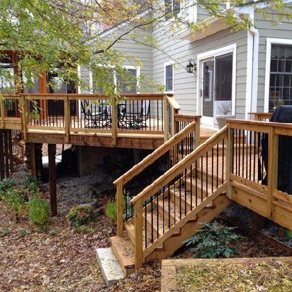 A wooden deck with stairs leading up to it